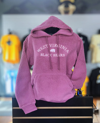 Pink hoodie with 'West Virginia Black Bears' text on a black box with a blurred background