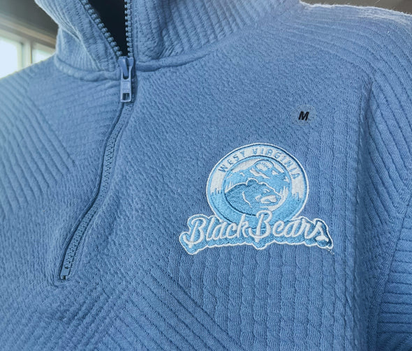 Blue pullover with 'Black Bears' logo on a textured fabric background